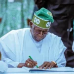 Bola Tinubu driving electric vehicle adoption with policy initiatives, featuring EV charging infrastructure, clean transport visuals, and a shift toward sustainable mobility in Nigeria.