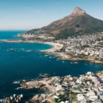 South Africa’s Q1 economic growth exceeding forecasts while highlighting rising risks from inflation, weak demand, and structural economic pressures.