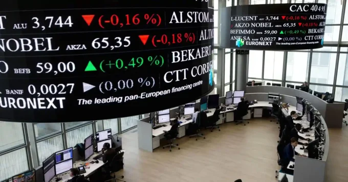 Euronext trading floor with electronic stock tickers and market screens, representing European stock markets, index movements, and investor sentiment.