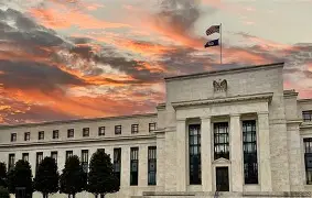 Federal Reserve building at sunset, representing US CD rates, interest rate policy, and fixed deposit market conditions in 2026.