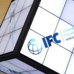 The International Finance Corporation raises $2 billion through a five-year green bond after investor demand reaches $8 billion, supporting climate-focused investments in emerging markets.