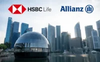 HSBC-branded glass office tower in a financial district, used to illustrate HSBC’s sale of HSBC Life Singapore and the related bancassurance partnership with Allianz.