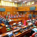 Parliamentary chamber with lawmakers seated during a legislative session, representing Kenya’s debate over Affordable Housing Levy oversight, public finance accountability and housing-fund transparency.