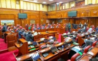 Parliamentary chamber with lawmakers seated during a legislative session, representing Kenya’s debate over Affordable Housing Levy oversight, public finance accountability and housing-fund transparency.