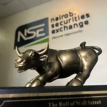 Bull statue displayed in front of the Nairobi Securities Exchange logo, representing the Kenya stock market rally and investor confidence in 2026.