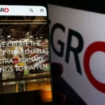 Phone showing the SEGRO website in front of SEGRO branding, representing the company’s logistics real estate business and takeover bid discussions.