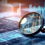 Magnifying glass placed over digital financial charts and bar graphs, symbolizing stock market analysis, index performance tracking and investment research.