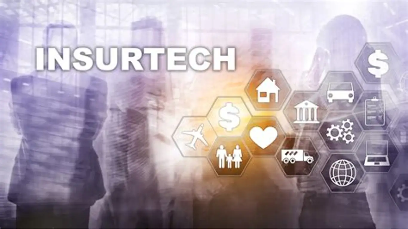 Business-themed insurtech image showing silhouettes of professionals with digital insurance icons, representing technology-driven insurance distribution and embedded insurance platforms.