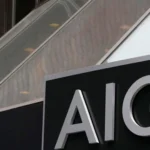 Close-up image of an AIG sign mounted on a building exterior, representing the global insurance group’s quarterly earnings, underwriting performance and investor outlook.