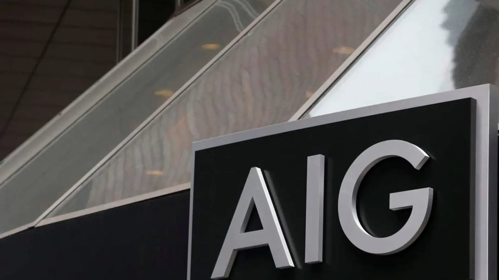 Close-up image of an AIG sign mounted on a building exterior, representing the global insurance group’s quarterly earnings, underwriting performance and investor outlook.