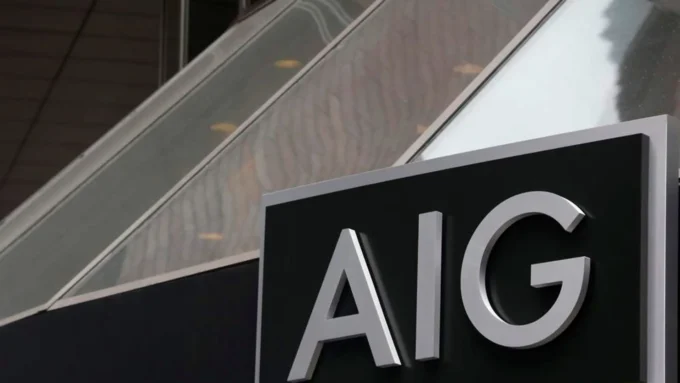 Close-up image of an AIG sign mounted on a building exterior, representing the global insurance group’s quarterly earnings, underwriting performance and investor outlook.
