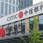 Exterior image of a CITIC / China CITIC Bank branch with the bank’s red logo and Chinese signage on a modern building facade. The image represents CITIC Bank, China’s banking sector, green financial bonds and RMB-denominated sustainable finance issuance.