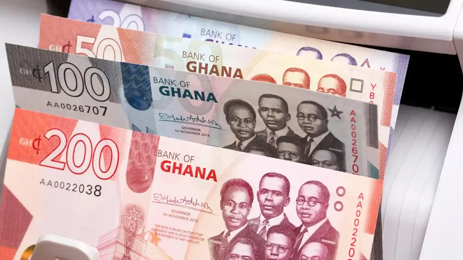Ghanaian cedi banknotes showing cash and fixed-income investment themes, representing Treasury bill yields, reinvestment risk and Ghana money-market returns.