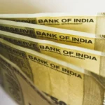 Close-up of Indian rupee banknotes with Reserve Bank of India text, representing rupee fixed deposits and bulk deposit rate transparency.