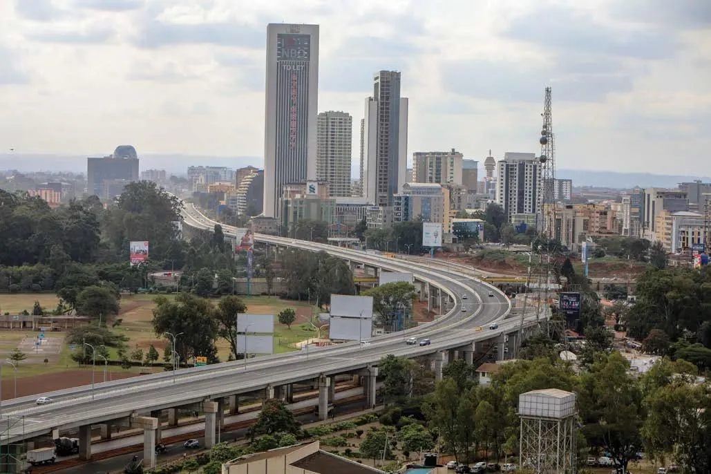 Wide cityscape image of Nairobi showing elevated roads, buildings and urban infrastructure, representing Kenya’s infrastructure development, public financing needs and the role of government infrastructure bonds.