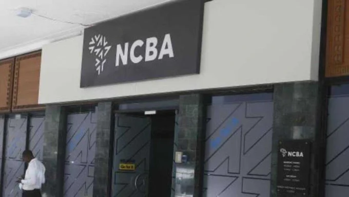 Exterior image of an NCBA branch entrance with the NCBA logo displayed above the doorway, representing the Kenyan banking group’s financial results, dividend announcement and investor outlook.