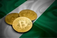 Image of gold crypto coins placed on a Nigerian flag, representing Nigeria’s digital-asset market, stablecoin regulation, crypto payments and central-bank supervision.