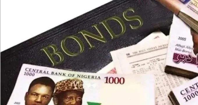 Image showing Nigerian naira notes and a document marked “Bonds,” representing Nigeria’s Federal Government bond market, naira-denominated sovereign debt, auction demand, fixed-income investing and government borrowing.