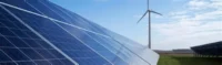 Solar panels in the foreground with a wind turbine in the background under a blue sky, representing renewable energy, clean-power infrastructure, climate finance and green-bond investment projects.