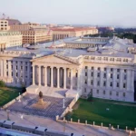 Aerial view of the U.S. Treasury building in Washington, D.C., used to illustrate stablecoin regulation, Treasury bill markets, reserve assets, U.S. financial policy and the GENIUS Act.