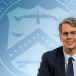 Article image showing a senior U.S. Treasury official in front of a Treasury-themed background and an American flag. The image represents U.S. financial regulation, stablecoin supervision, GENIUS Act implementation, Treasury rulemaking and digital-asset licensing.