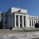 Goldman Sachs and JPMorgan see a Fed rate hike as inflation lingers, highlighting Federal Reserve policy, interest rates, inflation, and U.S. financial markets